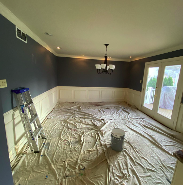 Springfield PA dining room before professional interior painting showing outdated wallpaper and worn paint