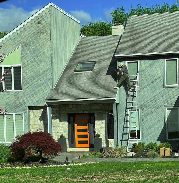 Springfield PA house exterior before professional painting showing weathered siding and faded trim